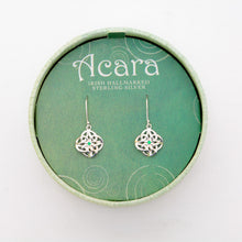 Load image into Gallery viewer, Silver hanging Celtic knot earrings, with green glass gem in the middle
