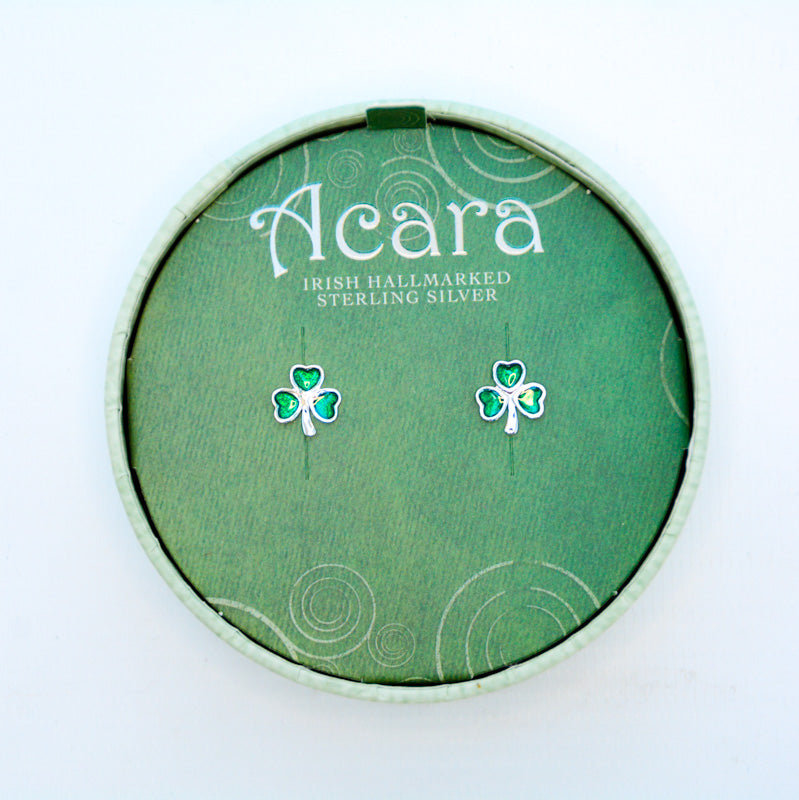 Silver stud earrings, with Shamrock shape. The shamrock leaves are filled with green glass. 